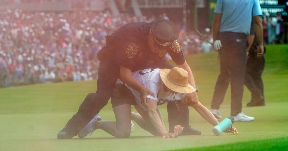 Protesters storm the 18th green at Travelers Championship